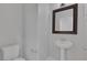 Powder room features a pedestal sink and standard toilet at 5484 Mercury Springs Dr, Las Vegas, NV 89122