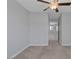 Clean bedroom with a ceiling fan, neutral walls, and soft carpet at 5484 Mercury Springs Dr, Las Vegas, NV 89122