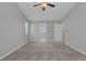 Neutral bedroom with a ceiling fan and carpet at 5484 Mercury Springs Dr, Las Vegas, NV 89122