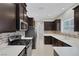 Contemporary kitchen with stainless steel appliances and dark wood cabinetry at 5484 Mercury Springs Dr, Las Vegas, NV 89122
