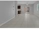 Bright living space featuring neutral tile flooring and sliding glass doors to the backyard at 5484 Mercury Springs Dr, Las Vegas, NV 89122
