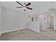 Cozy loft area with neutral carpet, a ceiling fan, and natural light at 5484 Mercury Springs Dr, Las Vegas, NV 89122