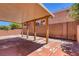 Covered patio with desert landscaping. Ready for outdoor relaxation and entertainment at 5484 Mercury Springs Dr, Las Vegas, NV 89122