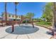 Community playground featuring modern play structures and mature landscaping at 5484 Mercury Springs Dr, Las Vegas, NV 89122
