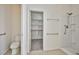 Bathroom with accessible shower, toilet, and linen closet at 5967 Sun Appello Ave, Las Vegas, NV 89122