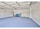 Spacious garage featuring epoxy flooring and ample storage space for vehicles and other belongings at 5967 Sun Appello Ave, Las Vegas, NV 89122