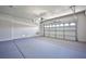 Clean two car garage with an automatic garage door at 5967 Sun Appello Ave, Las Vegas, NV 89122