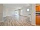 Bright and airy living room with hardwood floors and sliding glass doors to the backyard at 5967 Sun Appello Ave, Las Vegas, NV 89122
