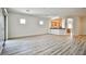 Bright living room with stylish wood flooring and easy access to the open kitchen and outdoor spaces at 5967 Sun Appello Ave, Las Vegas, NV 89122