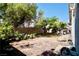 Spacious backyard with flagstone patio area, bordered by lush greenery and a privacy wall at 6131 Pumpkin Patch Ave, Las Vegas, NV 89142