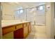 Bright bathroom featuring a vanity, mirror, and a shower-tub combination for a refreshing experience at 6131 Pumpkin Patch Ave, Las Vegas, NV 89142