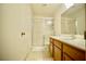 Clean bathroom with glass enclosed shower, long vanity, and tiled flooring at 6131 Pumpkin Patch Ave, Las Vegas, NV 89142