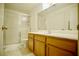 Bright bathroom with a glass-enclosed shower and light wood vanity with white countertop at 6131 Pumpkin Patch Ave, Las Vegas, NV 89142