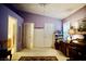 Airy bedroom featuring a vaulted ceiling, two closets, and a writing desk by the window at 6131 Pumpkin Patch Ave, Las Vegas, NV 89142