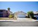 Charming single story home with a two car garage and desert landscaping at 6131 Pumpkin Patch Ave, Las Vegas, NV 89142