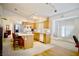 Bright kitchen with a breakfast bar, window seating area, and tile flooring at 6131 Pumpkin Patch Ave, Las Vegas, NV 89142