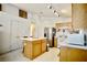 Bright kitchen with a breakfast bar, and tile flooring at 6131 Pumpkin Patch Ave, Las Vegas, NV 89142