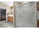 Attached bathroom features double sinks, tile floors, and glass shower at 6141 Tokara Ave, Las Vegas, NV 89122