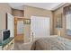 The well lit bedroom includes a large closet and an open doorway at 6141 Tokara Ave, Las Vegas, NV 89122