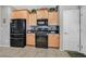 Kitchen area featuring stainless steel refrigerator and maple cabinets at 6141 Tokara Ave, Las Vegas, NV 89122