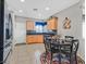 Eat-in kitchen with maple cabinets and black appliances at 6141 Tokara Ave, Las Vegas, NV 89122