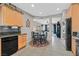Eat-in kitchen featuring tile floors, maple cabinets, and a breakfast nook at 6141 Tokara Ave, Las Vegas, NV 89122