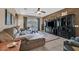 Cozy living room with tile flooring, ceiling fan, and a sliding glass door at 6141 Tokara Ave, Las Vegas, NV 89122