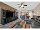 Inviting living room with tile flooring and an open layout to the kitchen at 6141 Tokara Ave, Las Vegas, NV 89122