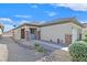 A single story home featuring a low maintenance desert rock yard at 6141 Tokara Ave, Las Vegas, NV 89122