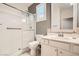 Bright bathroom featuring a glass enclosed shower, white vanity, and neutral grey walls at 6233 Canterbury Field Rd, Las Vegas, NV 89113