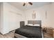 Bedroom with a gray bed, wooden accents, closet, and a modern decor and window with lots of light at 6233 Canterbury Field Rd, Las Vegas, NV 89113