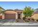 Charming single-Gathering home with a well-manicured front yard and a two-car garage in a quiet neighborhood at 6233 Canterbury Field Rd, Las Vegas, NV 89113