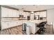Well-equipped kitchen featuring granite countertops, stainless steel appliances, white cabinets, and modern fixtures at 6233 Canterbury Field Rd, Las Vegas, NV 89113