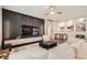 Bright living room with stylish decor, modern artwork, and hardwood flooring throughout the living space at 6233 Canterbury Field Rd, Las Vegas, NV 89113