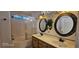 Bathroom features a soaking tub with shower, double vanity and decorative mirrors at 6275 Allspice Ct, Las Vegas, NV 89142