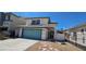 Charming two-story home with well-manicured lawn and vibrant turquoise garage door at 6275 Allspice Ct, Las Vegas, NV 89142