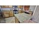 Well-appointed kitchen featuring granite countertops, stainless steel appliances, and center island at 6275 Allspice Ct, Las Vegas, NV 89142