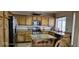 Updated kitchen with stainless steel appliances, granite countertops, and custom cabinetry at 6275 Allspice Ct, Las Vegas, NV 89142