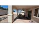 Covered patio with ceiling fan and room for outdoor dining at 6275 Allspice Ct, Las Vegas, NV 89142