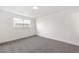 Bright bedroom featuring neutral gray carpeting and freshly painted white walls at 6308 Lawton Ave, Las Vegas, NV 89107