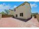A private backyard features brick pavers, a grill, and easy access into the home at 6678 Crystal Run Ln, Las Vegas, NV 89122