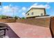 Spacious backyard featuring a brick patio and block wall, perfect for outdoor entertaining at 6678 Crystal Run Ln, Las Vegas, NV 89122