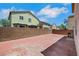 Spacious backyard with brick pavers, a grill, and a block wall for privacy at 6678 Crystal Run Ln, Las Vegas, NV 89122