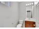 Clean, half bathroom with vanity, mirror, and toilet at 6678 Crystal Run Ln, Las Vegas, NV 89122