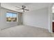 Spacious bedroom features a ceiling fan and large window, providing natural light at 6678 Crystal Run Ln, Las Vegas, NV 89122