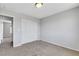 Bedroom featuring neutral carpet, paint, closet and a view to another room at 6678 Crystal Run Ln, Las Vegas, NV 89122