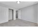 A carpeted bedroom with closet space offers ample storage and natural light at 6678 Crystal Run Ln, Las Vegas, NV 89122