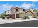 Street view of a two story home featuring solar panels and desert landscaping at 6678 Crystal Run Ln, Las Vegas, NV 89122