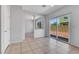 Bright living space with a sliding glass door to the backyard and arched doorway at 6678 Crystal Run Ln, Las Vegas, NV 89122