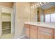 Bright bathroom offers a vanity with a large mirror and doorway to closet at 713 Chase Tree St, Las Vegas, NV 89144